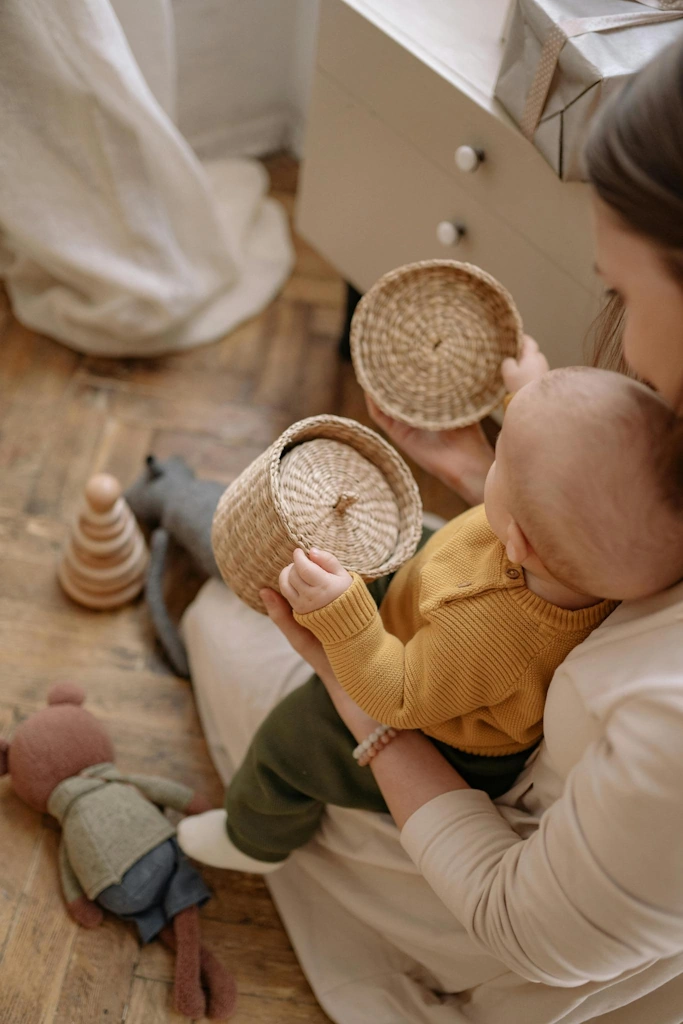 mum and baby playing with baskets